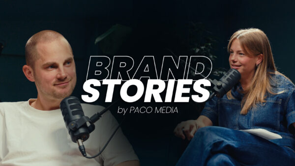 Podcast discussion with microphones present.